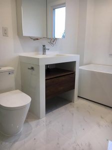 Toronto bathroom renovation Project by milman featuring while bathroom tiles, vanity and fittings