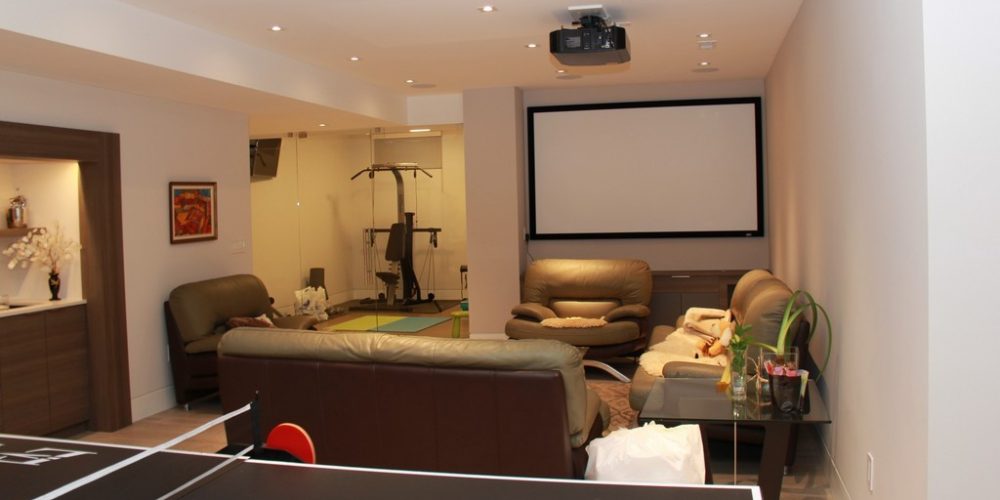 Toronto basement renovation featuring media room designed and renovated by Milman design build