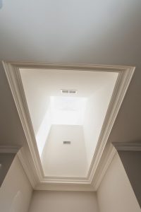 Toronto basement renovation featuring smooth celling's with crown molding's installed by Milman design build
