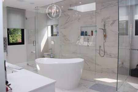 Modern white bathroom renovated by Milman Design Build