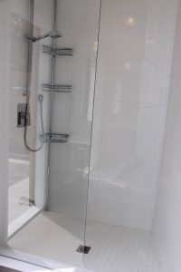 Toronto bathroom renovation project featuring glass enclosure for walk-in shower