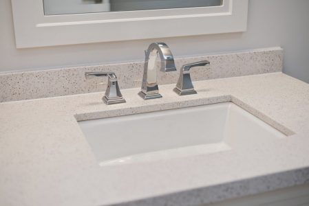 Toronto bathroom renovation project featuring white faucet and vanity