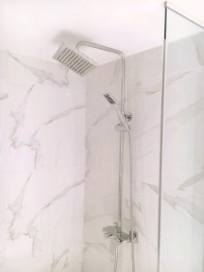 Toronto Bathroom renovation by Milman Design build features white tiles and walk in shower