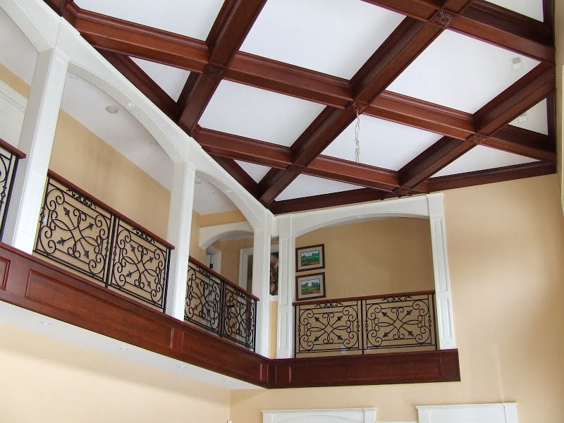 Home renovation project by Milman Design Build, Toronto Home Renovation contractors featuring custom celling with wooden trims and classic Iron railings