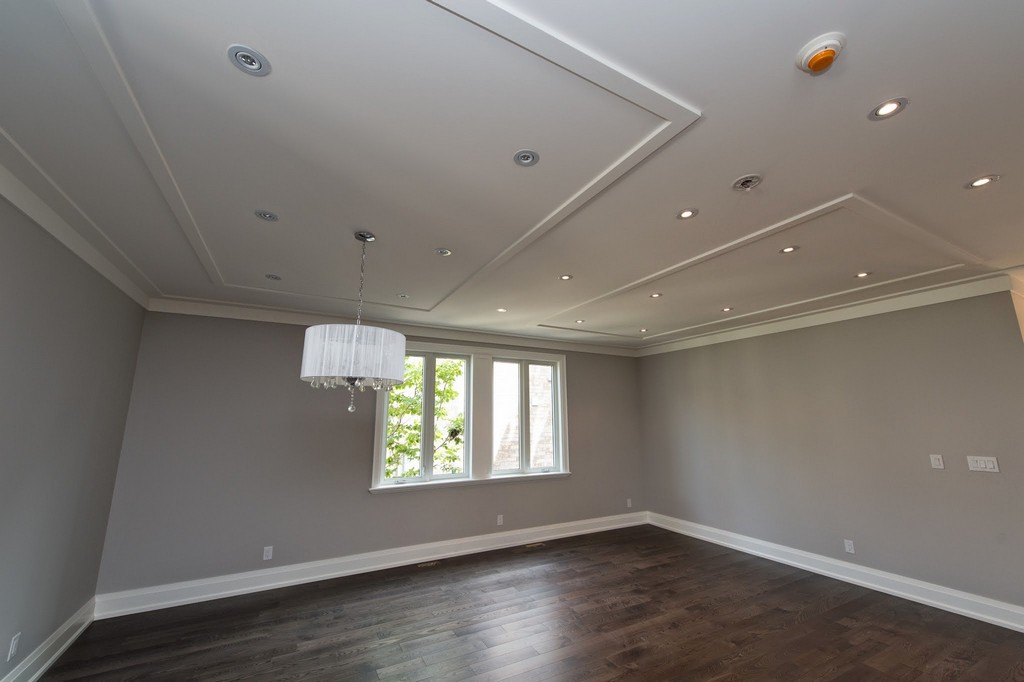 Home renovation project by Milman Design Build, Toronto Home Renovation contractors featuring large living room with custom celling and trims